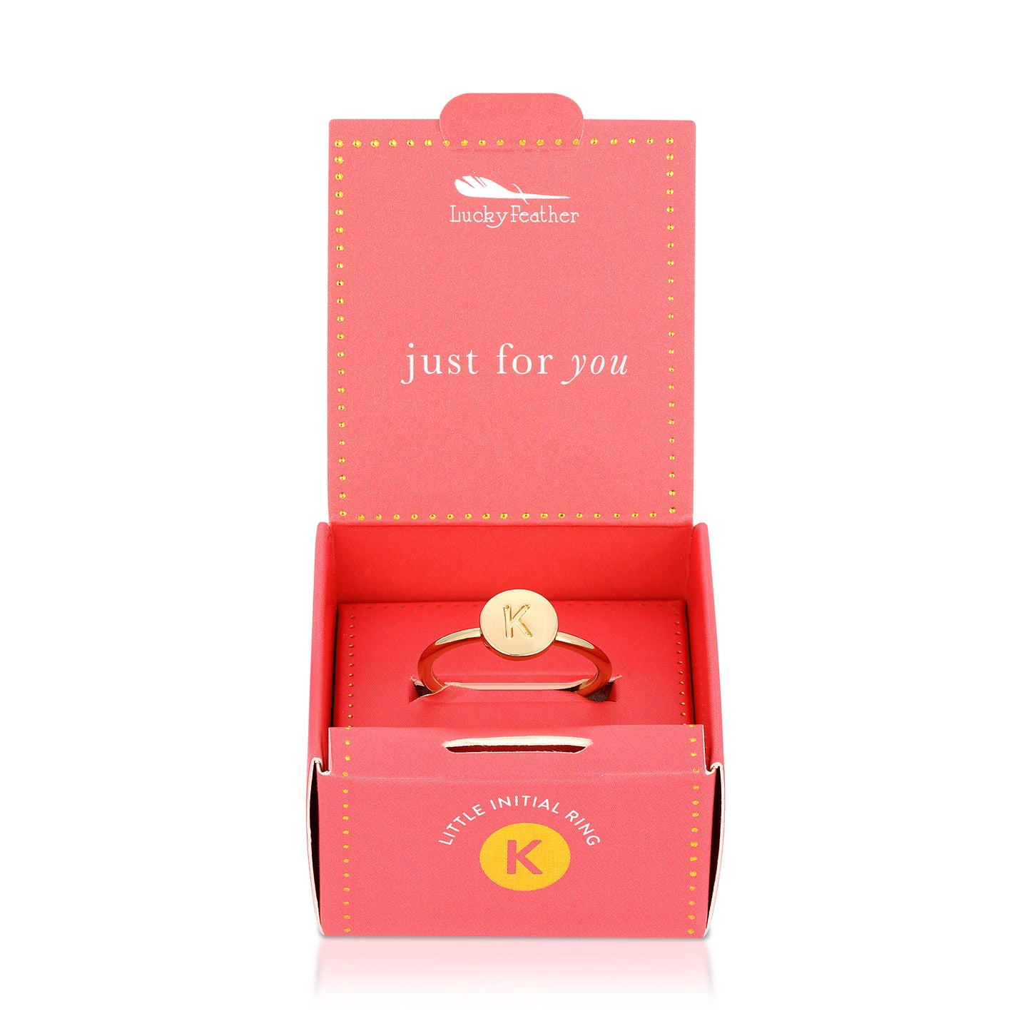 An open red box with "Lucky Feather" and "just for you" displayed, contains a gold-colored ring with the letter "K" on it.