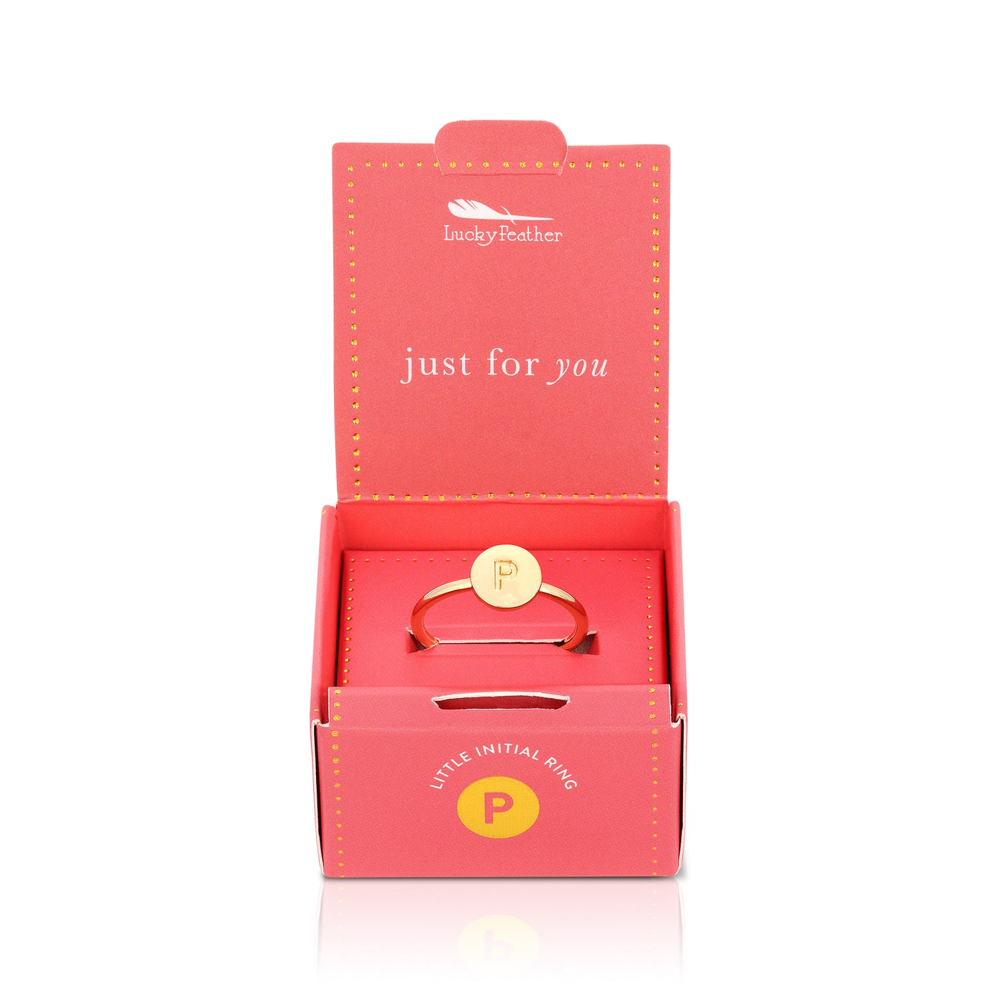 A gold-colored ring with the letter "P" sits inside an open, decorative pink box labeled "Lucky Feather."