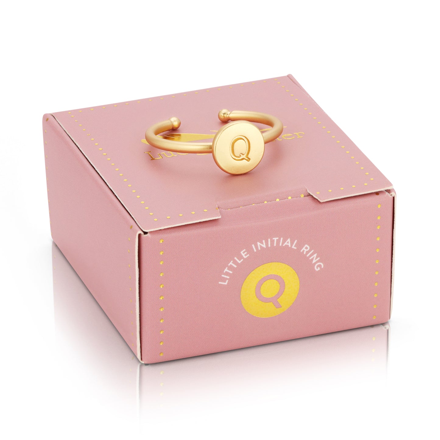 A ring with the letter "Q" rests on a pink "Little Initial Ring" box.