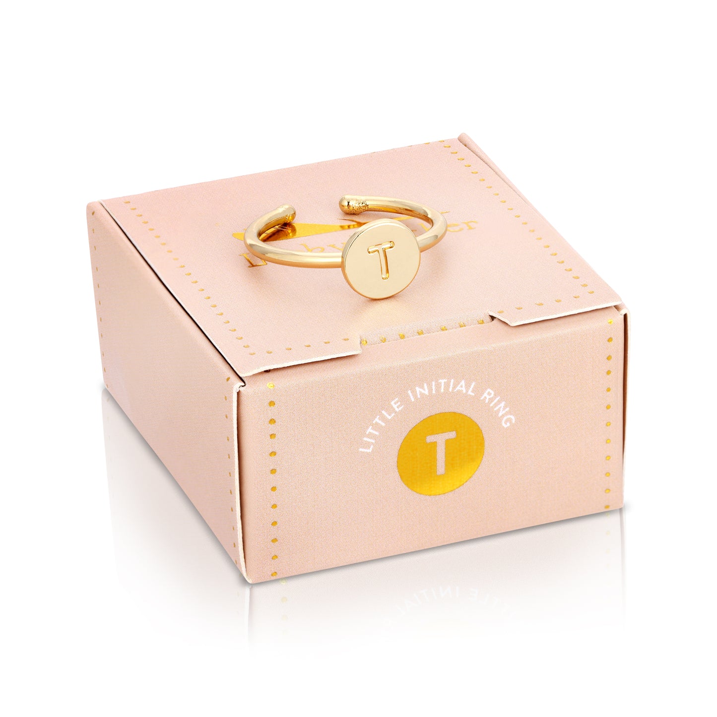 A gold-colored "T" initial ring sits atop its pink patterned box.