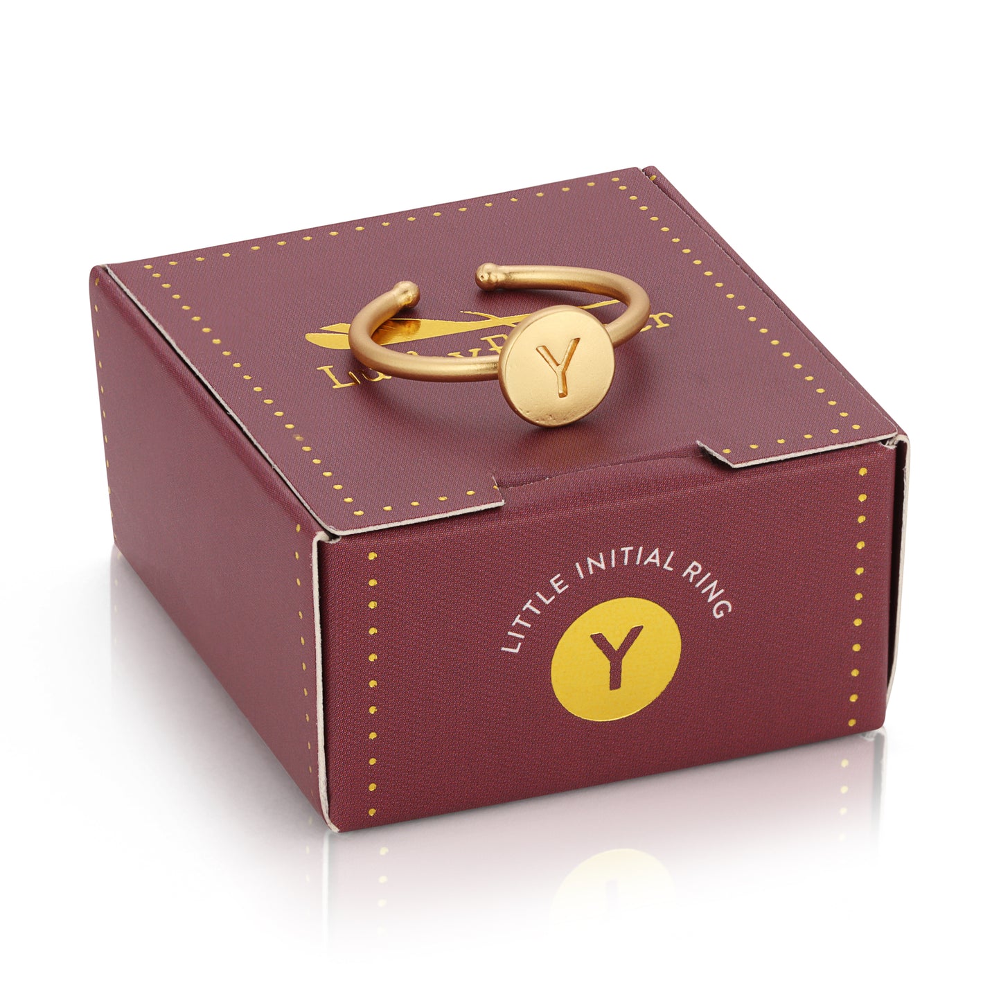 A gold initial ring with the letter "Y" rests on a burgundy box.