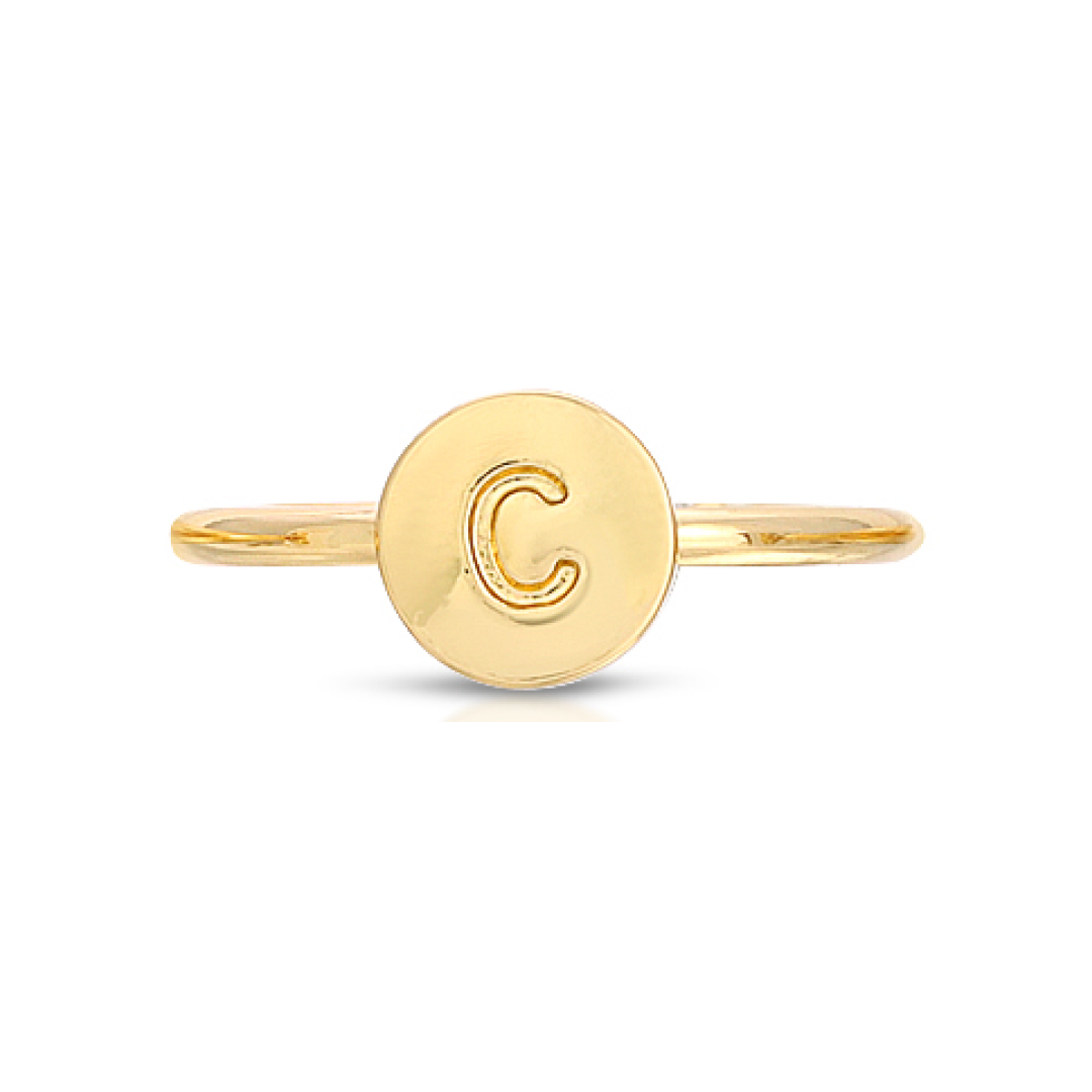 A gold ring with a circular face bearing the letter "C" is centered on a white background.
