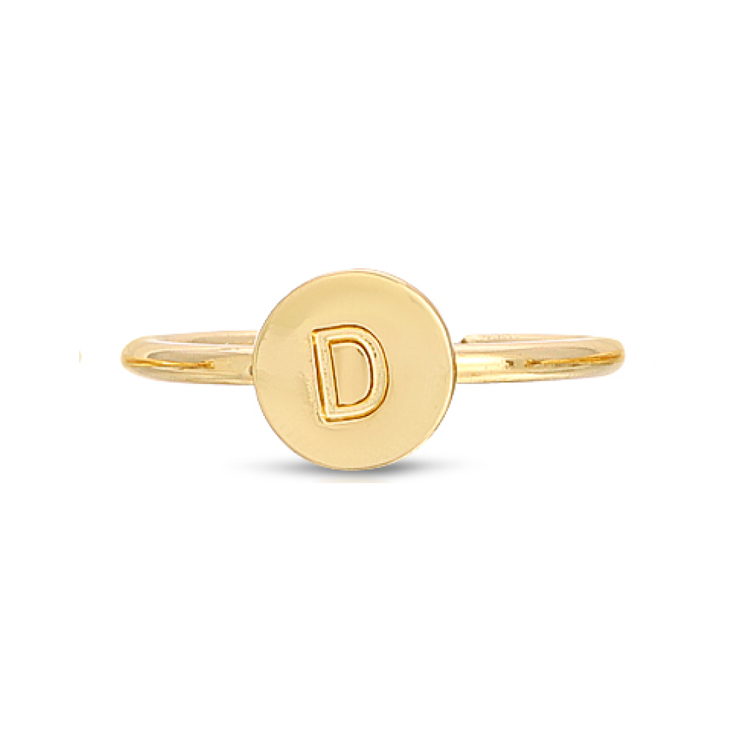 A gold ring with a circular face displaying the letter "D".