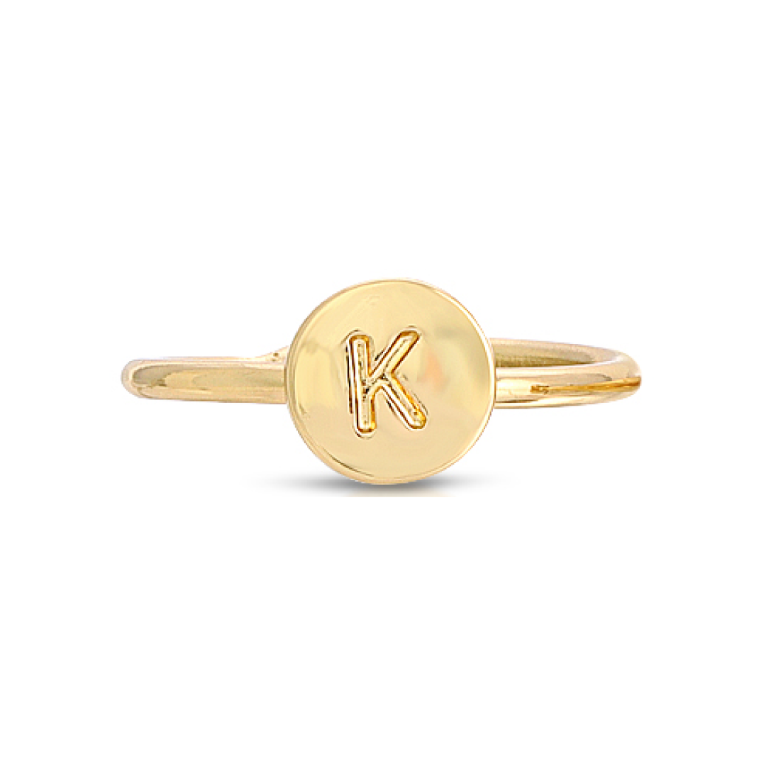 A gold ring features a circular face with the letter "K" engraved on it.
