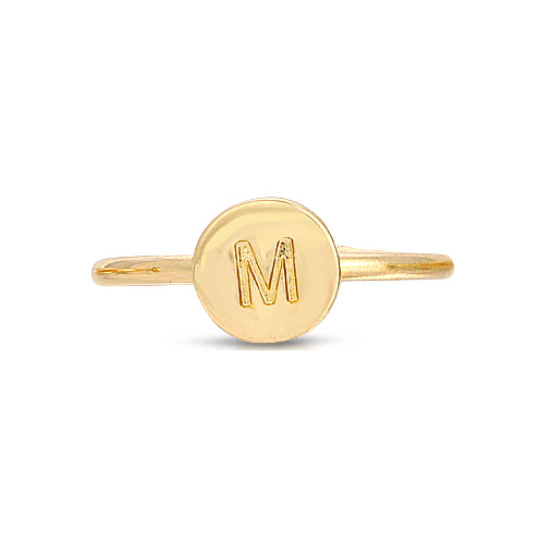 A gold-colored ring with a circular face displaying the letter M.