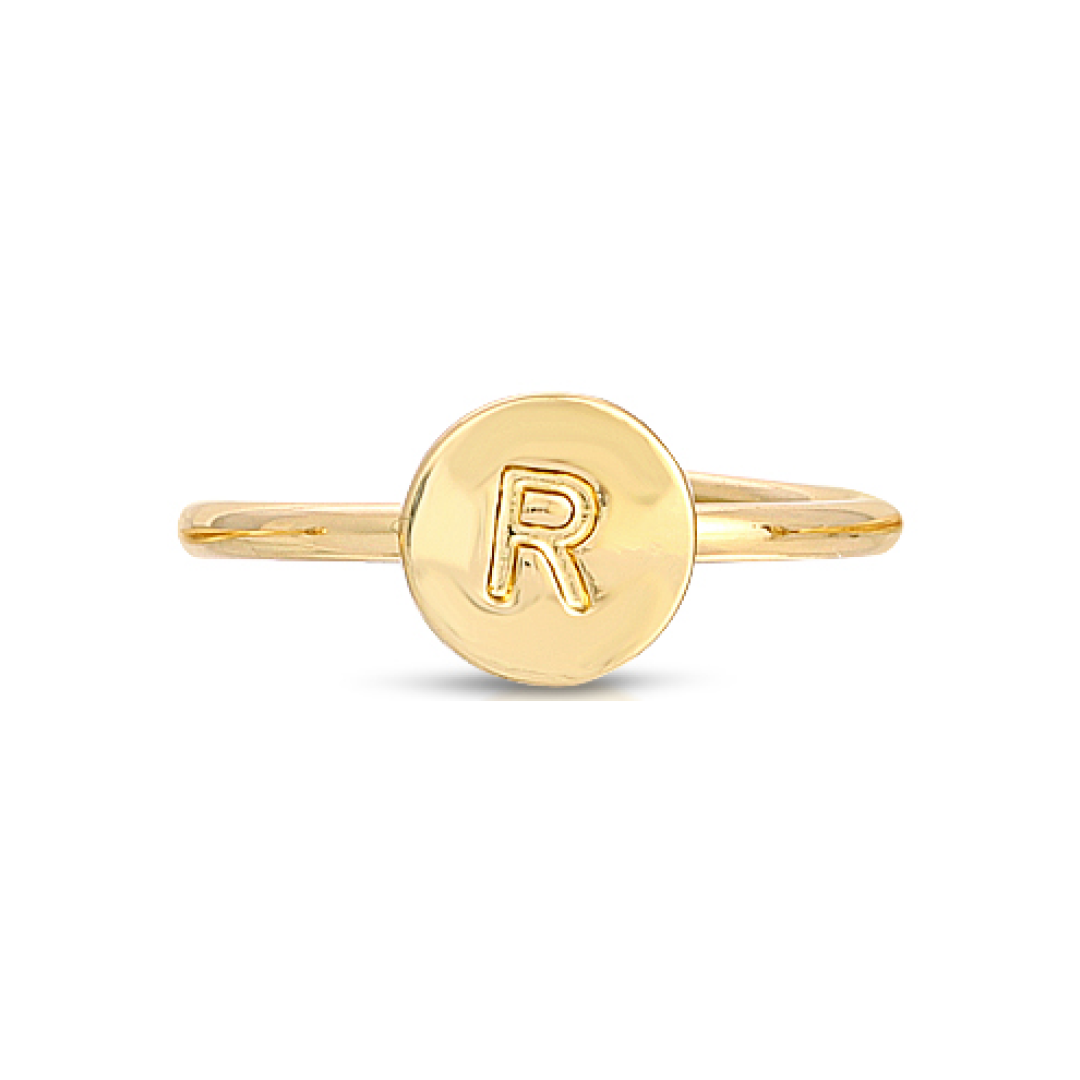 A gold ring features the letter "R" on a circular face.