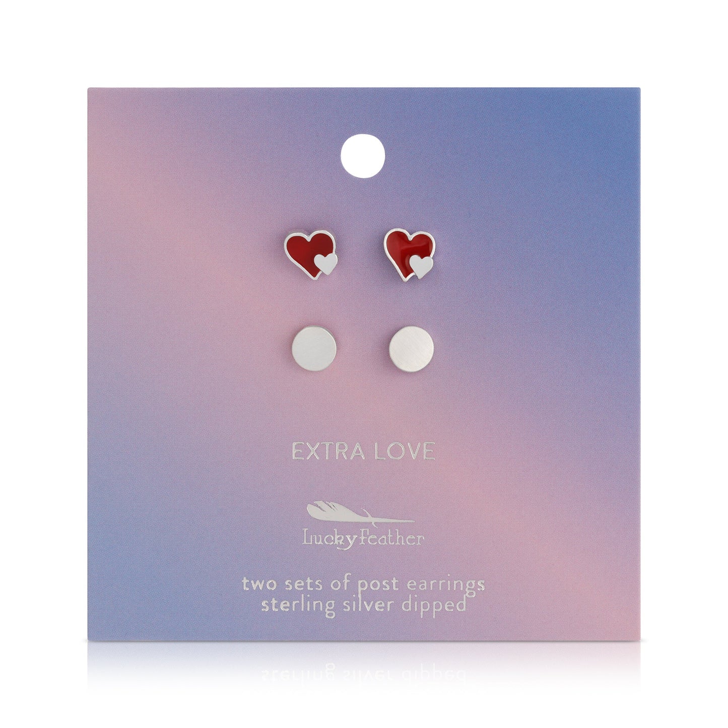 Two sets of post earrings, heart-shaped and round, on a pastel-colored card.