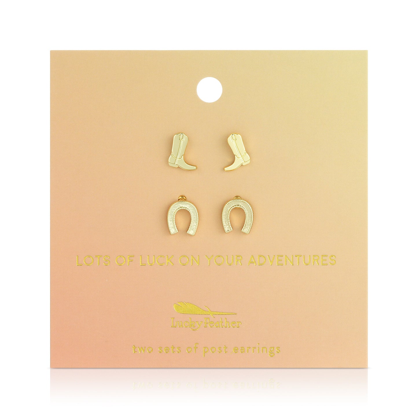 Two sets of earrings (cowboy boots and horseshoes) are displayed on a peach colored card.