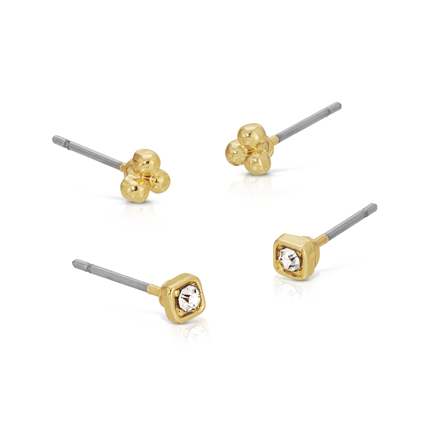 Four single stud earrings, two gold three-ball clusters and two gold squares with a clear gem, sit on a white background.
