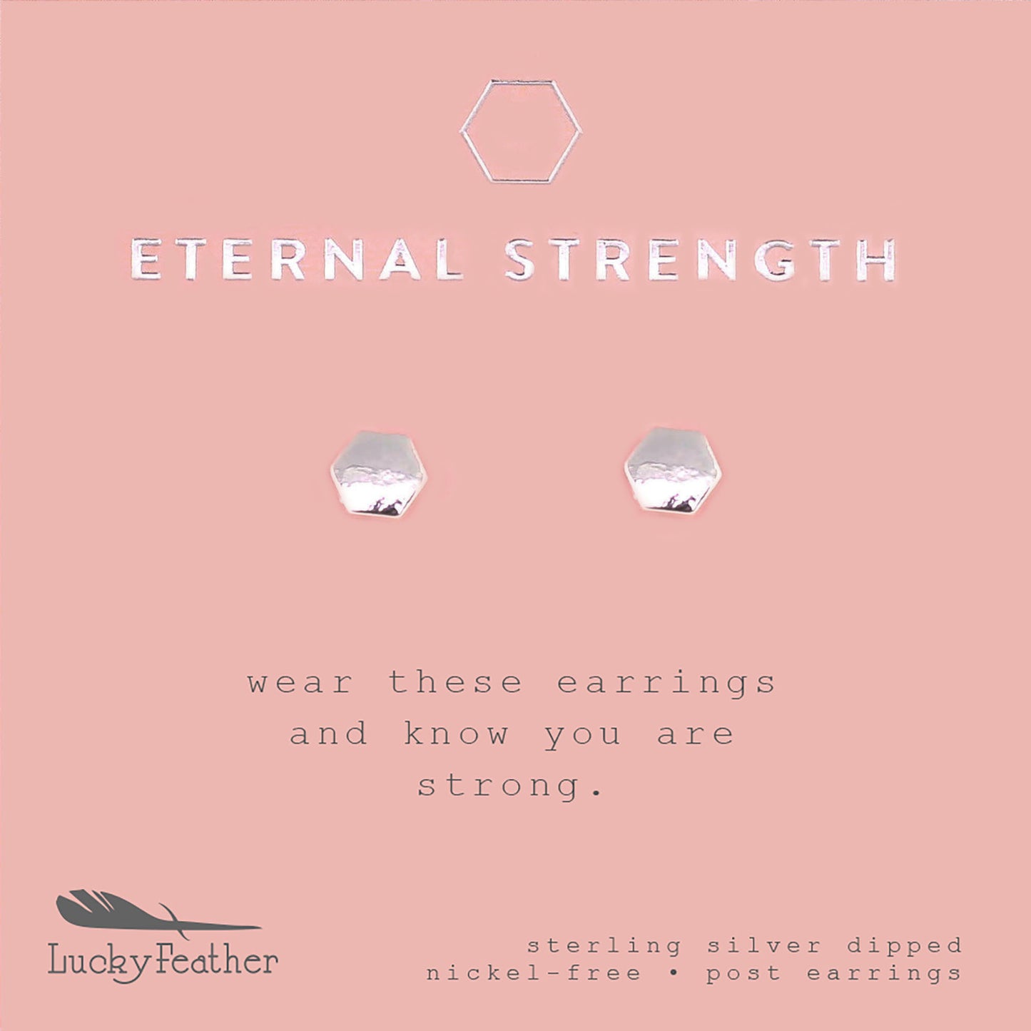 Promotional image for "Lucky Feather" featuring sterling silver dipped, nickel-free, hexagon-shaped post earrings on a pink background with the text "ETERNAL STRENGTH".