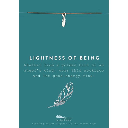 A teal card with a silver feather necklace and the words "Lightness of Being".