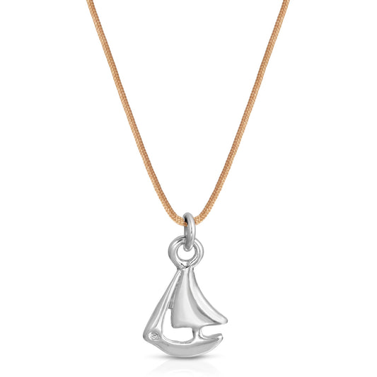 A silver sailboat pendant hangs from a light brown cord necklace.