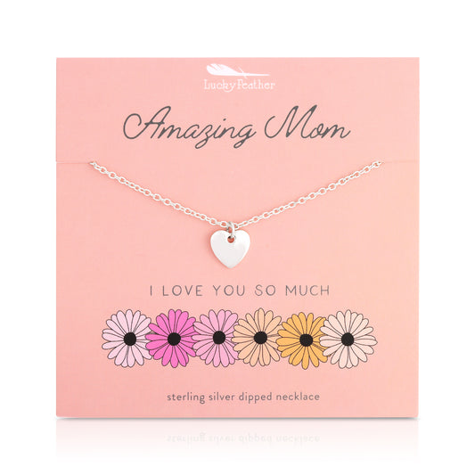 Sterling silver heart necklace displayed on a pink card with floral illustrations.