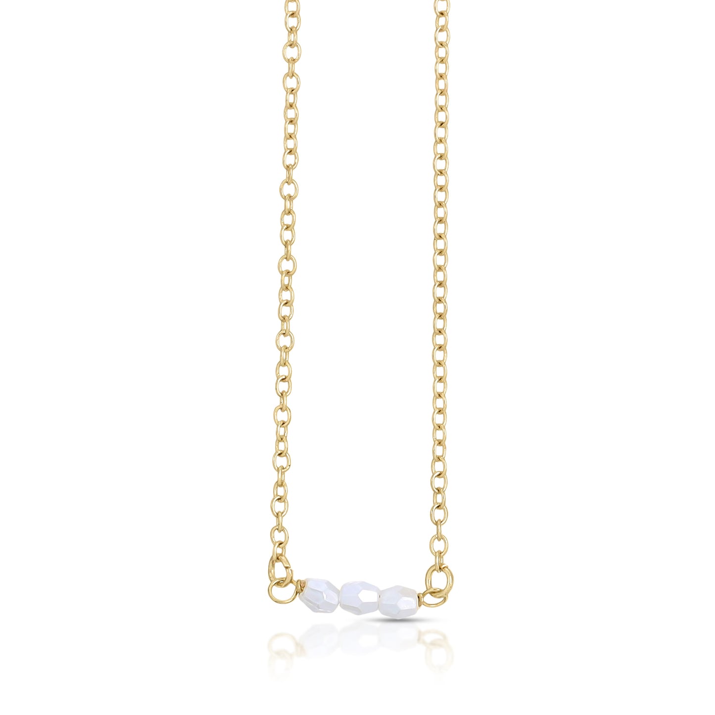 Gold chain necklace with three white faceted beads.