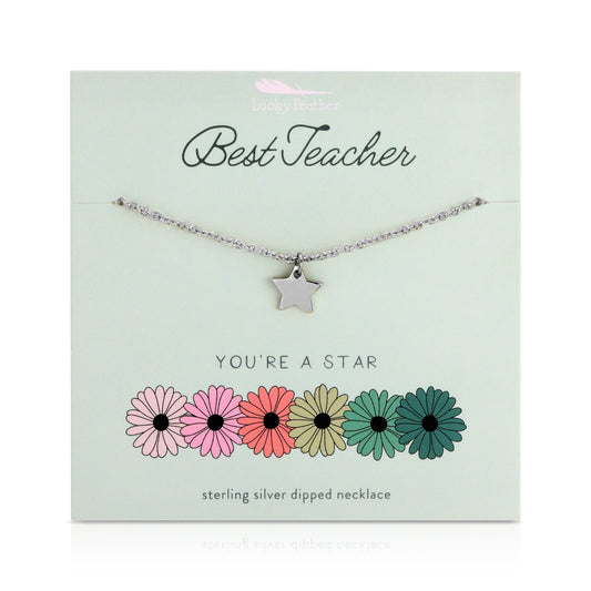 A silver star necklace is displayed on a mint green card that reads 'Best Teacher' and 'You're a Star' and has a row of stylized flowers.
