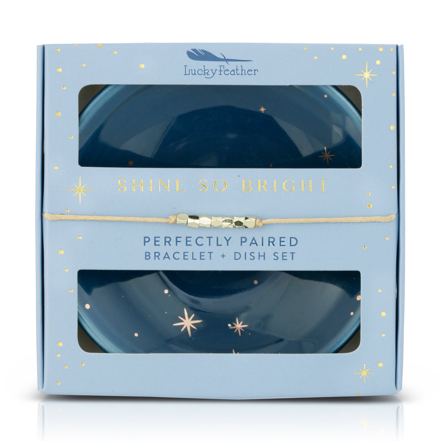 A "Lucky Feather" gift box for a bracelet and dish set, with celestial imagery and gold accents.