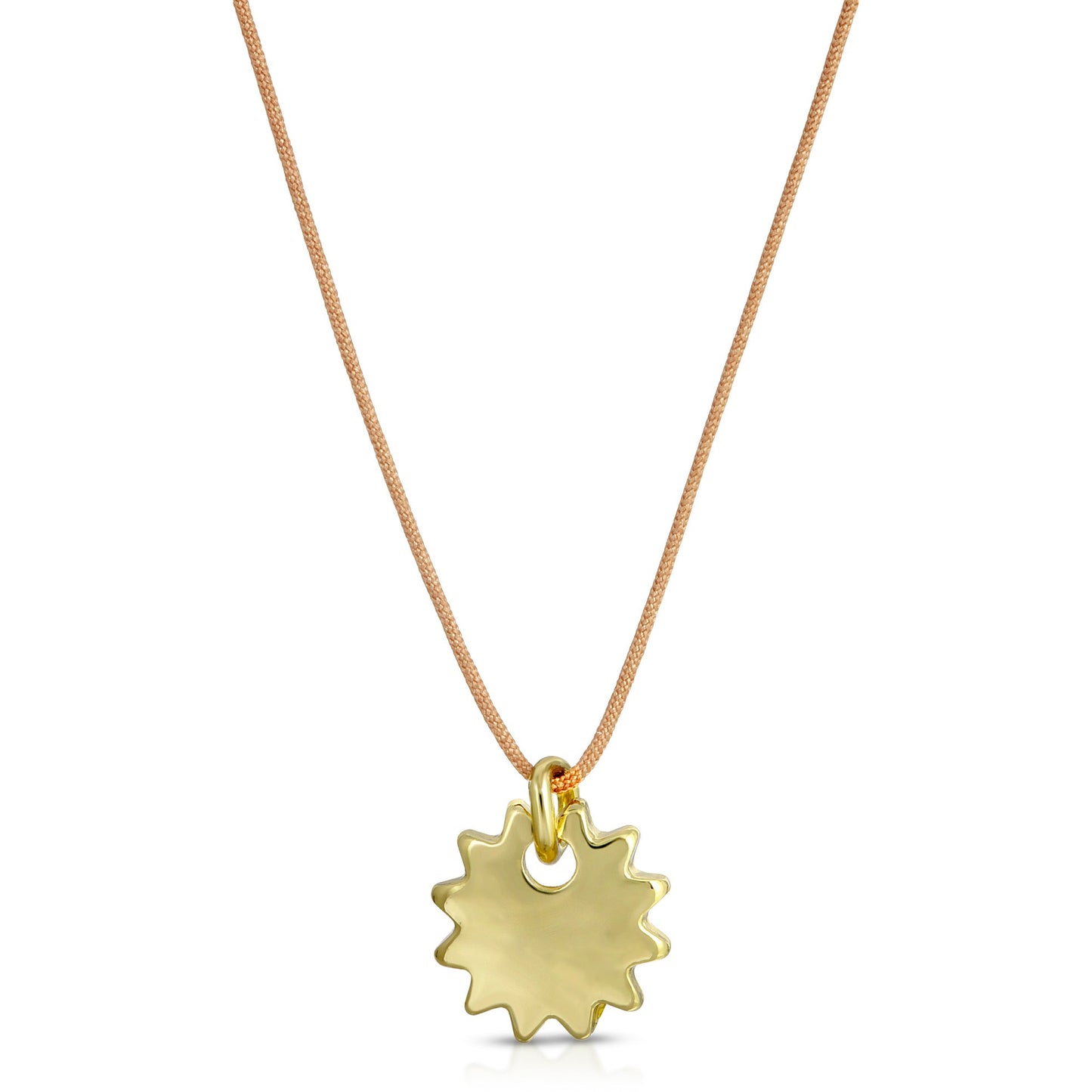 A gold sunburst pendant hangs from a tan cord necklace.