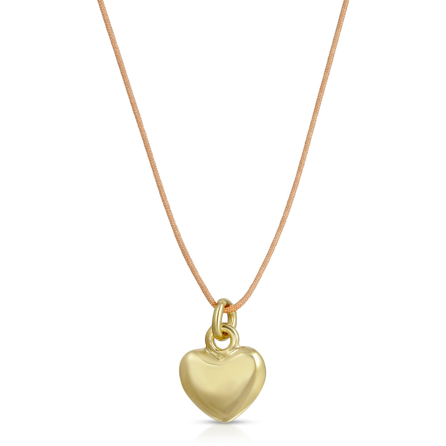 A gold heart pendant necklace hangs on a tan cord.